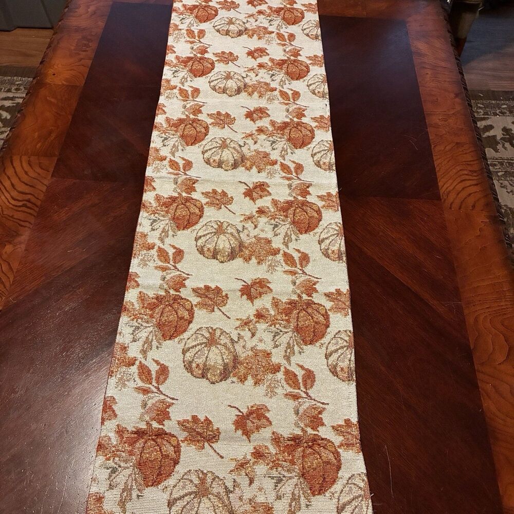 Table Runner with fall pumpkins and leaves on a light background. 68"x13"